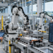 Automated manufacturing facility with industrial robots and digital monitoring systems