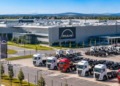 Modern truck manufacturing plant in Poland with rows of heavy trucks outside