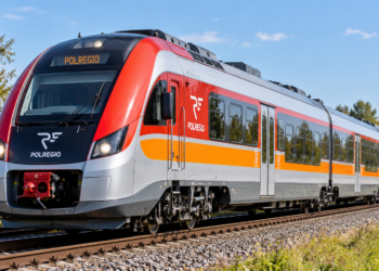 AI-generated editorial illustration of a red-and-white POLREGIO-style regional diesel train on railway tracks; not a photograph of one of the purchased trains