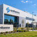 AI-generated conceptual illustration of a pharmaceutical facility with fictional Synthaverse signage; this is not an actual photograph of Synthaverse's Lublin plant